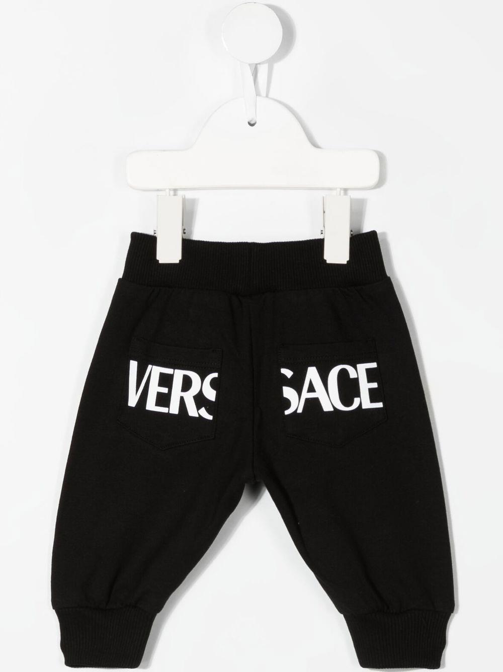 Shop Versace Trousers With Grech In Nero